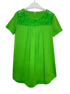 Detail shot of bright green short-sleeve T-shirt with intricate lace neckline and pleats