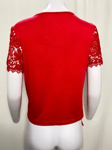 Back view of elegant red women's top with intricate floral lace short sleeves details