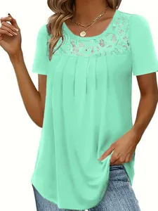 Detailed view of women's mint green short sleeve top featuring elegant lace neckline trim