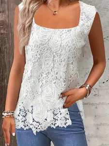 Close-up of elegant white floral lace sleeveless tank top with square neckline.