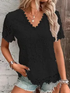 Detailed view of women's black floral lace short-sleeve V-neck top