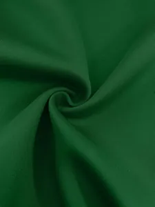 Close-up macro detail of dark green high-quality blazer fabric with fine woven texture