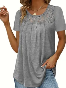 Detail of grey short sleeve top featuring an elegant lace neckline and front pleats.