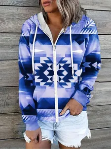 Close-up view of women's blue geometric print zip-up hoodie showing print details