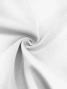 Detailed macro view of white textured premium suit fabric showing fine knit pattern