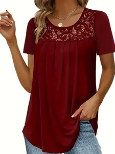 Close-up of wine red short sleeve top with elegant lace neckline and pleated detail.