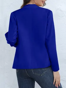Back view of a vibrant royal blue long sleeve blazer with a stand-up collar design