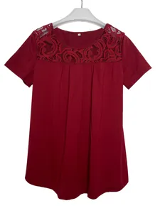 Detail view of wine red T-shirt featuring elegant lace neckline and pleated front design