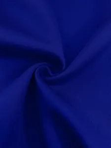 Detailed texture of royal blue fabric for a women's solid color fashion suit