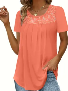 Close-up detail of women's orange short sleeve t-shirt with elegant lace neckline