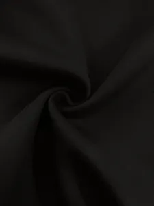 Close-up of premium black fabric showing smooth texture and very fine knit detail