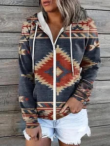 Macro detail of the ethnic geometric pattern on the zip-up hooded sweatshirt