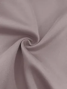Close-up of dusty rose fabric texture showing fine knit detail and soft drape for blazer.