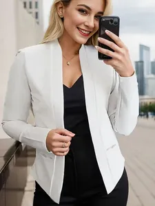Detail view of a white minimalist open-front blazer with pocket accents for women