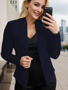 Detail view of the stylish navy blue collarless blazer jacket on a model selfie