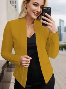 Close-up of a women's mustard yellow open front blazer featuring pockets on a model.