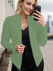 Detail showing a stylish olive green open-front blazer with side pockets on a model.