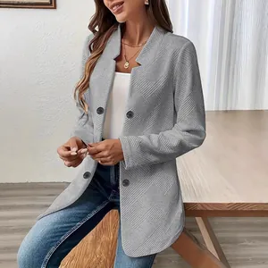 Detailed view of women's grey textured cardigan coat with stand collar and buttons.