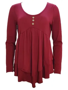 Detail of burgundy long sleeve tunic with three buttons and pleated ruffle hem