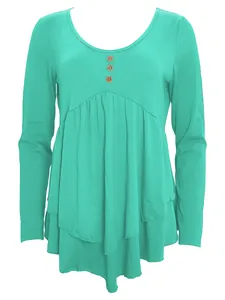 Detail showing mint green long sleeve casual top with three buttons and ruffled hem