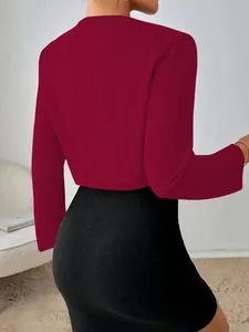 Detailed back view of a professional maroon cropped long-sleeve jacket for women