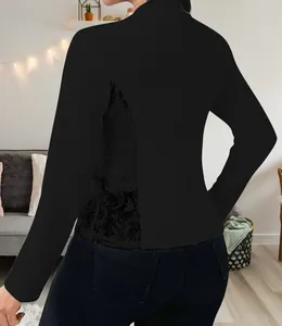 Back view of an elegant black blazer for women featuring delicate lace side stitching details