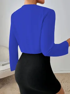 Detailed rear view of a vibrant blue cropped long-sleeve jacket featuring a slim fit