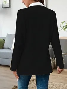 Back view of a black women's blazer with a white collar and gold sleeve buttons