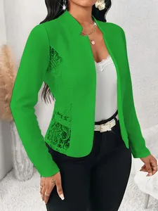 Close-up view of elegant bright green blazer featuring intricate side floral lace splicing