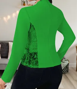 Detail view showing the lace patchwork on the back of this elegant green slim-fit blazer.