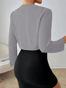 Elegant slim fit cropped grey long sleeve blazer for women viewed from the back side