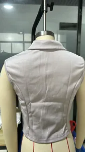 Detailed back view of a women's slim-fit sleeveless lapel vest blazer on a mannequin.
