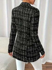 Back view of a slim fit black and white plaid tweed blazer for women with lapels.