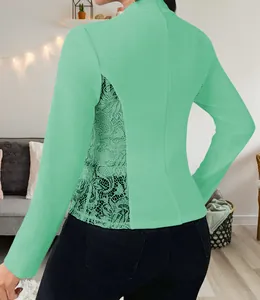 Back view of mint green long sleeve blazer featuring elegant side lace patchwork detailing.