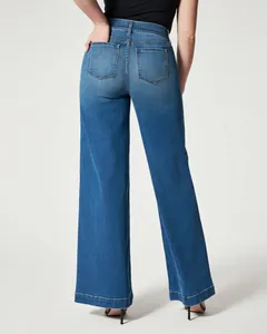 Back view of high-stretch wide-leg denim jeans for women in washed blue
