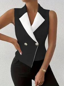 Detail of black and white double-breasted sleeveless blazer vest with gold buttons.