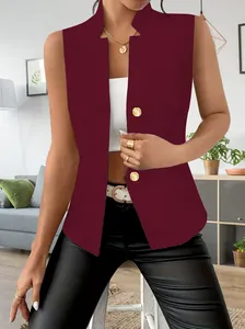 Detailed view of burgundy sleeveless blazer with gold buttons