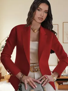 Detail view of red lapel long-sleeved blazer with three elegant gold buttons on cuffs.