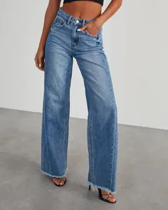 Detail view of wide-leg jeans with side seam stitching and raw fringed hem