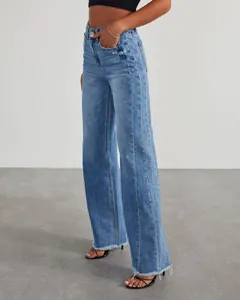 Detailed side view of women's wide-leg jeans with side seam patchwork and frayed hem