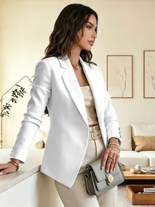 Detail view of white long-sleeved blazer with three-button cuffs in a chic setting
