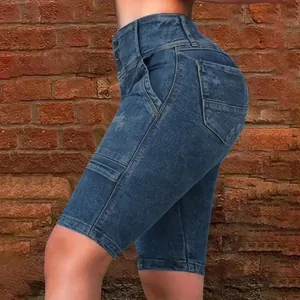 Detail view of slim-fit high-waisted denim shorts for women in classic dark blue wash