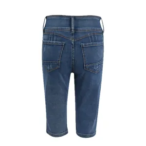 Back view detail of women's slim fit blue denim capri shorts with pocket stitching
