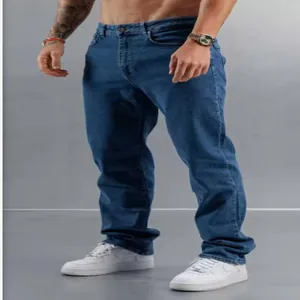 Detailed full-length shot of men's slim-fit blue denim jeans with classic styling