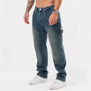 Stylish men's loose-fit patchwork denim jeans with washed blue finish for street fashion