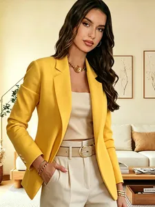 Detail shot of bright yellow women's blazer with triple-buttoned cuffs and notched lapel