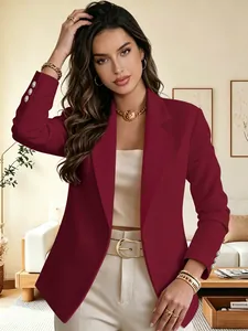 Detailed view of a stylish burgundy blazer featuring elegant lapels and cuff buttons.