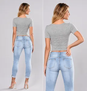 Rear view detail showing the slim fit of light blue denim skinny jeans for women