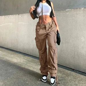Detail view of women's vintage high waist brown cargo pants with multiple side pockets