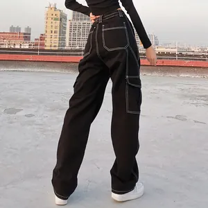 Detailed back view of women's high-waisted black cargo pants with white contrast stitching